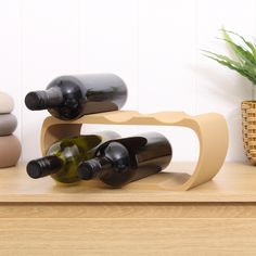 two bottles of wine are sitting on a shelf