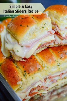 two sandwiches stacked on top of each other with cheese and meat in the middle,