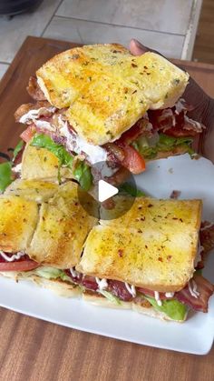 the sandwich is cut in half and ready to be put into the oven on the cutting board