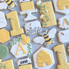 decorated cookies are arranged in the shape of honeycombs and beehivees