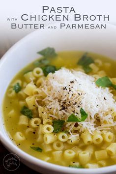 pasta with chicken broth, butter and parmesan cheese in a white bowl