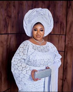 White lace iro and buba Blouse And Iro Styles Lace 2024, White Lace Iro And Blouse Styles, Oleku Iro And Buba Styles Lace, Buba And Wrapper Styles, Lace Work Wedding Dresses, Buba Styles, White Lace Formal Sets, Elegant Lace Sleeves Dress For Ceremony, Elegant Lace Dress With Lace Sleeves For Ceremonies