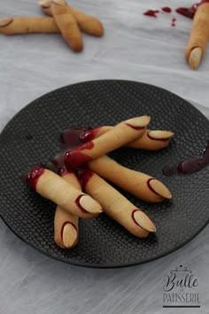 a plate with fake nails and blood on it