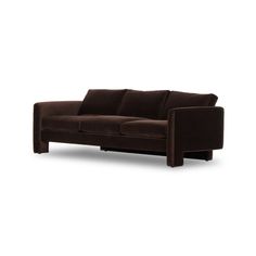 a brown couch sitting on top of a white floor