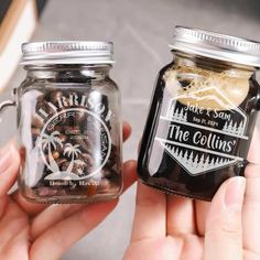 two hands holding jars filled with nuts and coffee beans, one has a logo on it