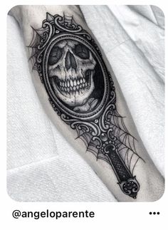 a skull with a magnifying glass on his arm