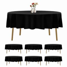 a table with six chairs and a vase with flowers on it, all in black