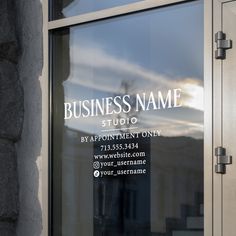 a business name sign in the window of a building