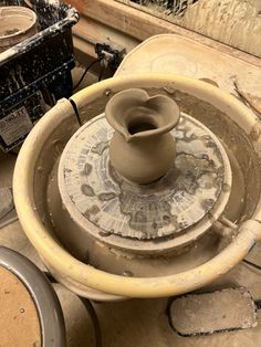 an unfired heart shaped vase made from clay sitting on a potter’s wheel. Potter Aesthetic Clay, Wheel Thrown Pottery Forms, Ceramics Class Aesthetic, Ceramic Vase Wheel Thrown, Pottery Throwing Aesthetic, Pottery Asthetic Ideas, Wheel Projects Pottery, Simple Wheel Thrown Pottery, Ceramics Wheel Ideas