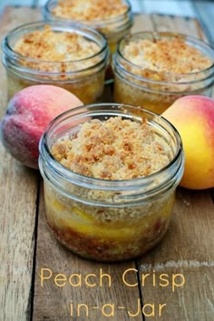 peach crisp in a jar on a wooden table with peaches and two peaches