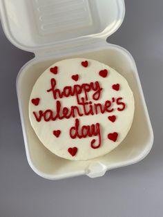 a heart - shaped cake in a foam container with the words happy valentine's day written on it