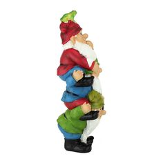 a small figurine of a gnome holding a frog