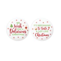 two christmas buttons with words on them