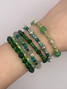 For those who prefer silver, this is the silver line of green beaded bracelets, each with a unique and special design. The charms dangle delicately on the wrist, and are combinable. Cheap Green Beaded Bracelets, Unique Green Beaded Bracelets, Cheap Green Bracelets, Cheap Hypoallergenic Green Bracelets, Cheap Green Holiday Bracelets, Cheap Green Beaded Bracelets For Birthday, Cheap Green Novelty Beaded Bracelets, Elegant Green Charm Bracelet With Round Beads, Green Friendship Bracelets With Spacer Beads As A Gift