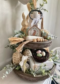 a bird's nest with eggs and other decorations