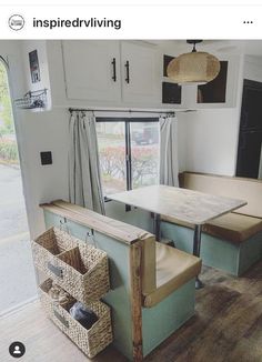 the inside of a mobile home with two tables and chairs