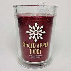 a candle that is sitting inside of a glass cup with the words spiced apple today on it