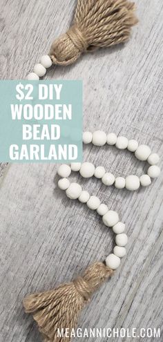 the diy wooden bead garland is made with white beads and tassels