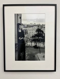 a black and white photo hanging on the wall