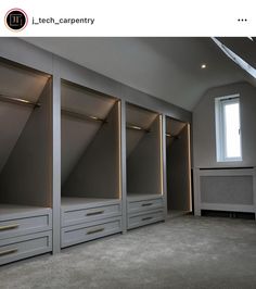 an empty room with some drawers and lights