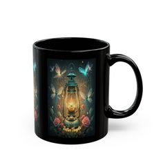 a black coffee mug with an image of a lantern and butterflies on the side,