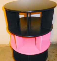 three tiered black and pink side table