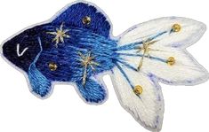 a blue and white fish with stars on it's tail