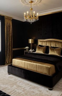 a black and gold bedroom with a chandelier