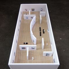 a model of a house with all the furniture and accessories laid out on the floor