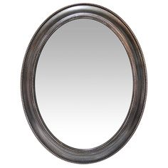 an oval mirror with beading around the edges