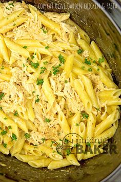 pasta with chicken and parmesan cheese in a crock pot on the stove