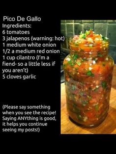 a jar filled with food sitting on top of a wooden table