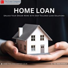 a person holding a small house in their hands with the words home loan on it