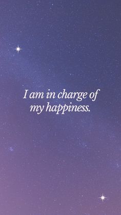 the words i am in charge of my happiness against a night sky background with stars