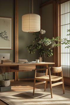 a wooden desk with a plant on it in front of a window and a lamp hanging from the ceiling