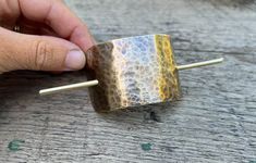 "Free shipping on orders of $35+ This hand hammered brass hair slide is the perfect effortless hair accessory. A simple way to add a little something extra to your everyday updo! This bun holder is made from hammered brass sheet that is about 2 inches across and 1 and a half inches high, and a 4 inch brass wire pin - all with a little patina for a distressed look. This large version is best for \"all up\" or bun hairstyles. Please ask any and all questions before purchasing. I am happy to answer Bohemian Hair Accessories, Effortless Hair, Bohemian Hair, Minimalist Hair, Bun Holder, Bohemian Hairstyles, Hair Fork, Effortless Hairstyles, Hammered Brass