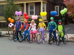 a group of people on bikes with balloons