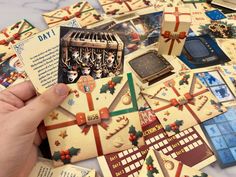 a hand is holding an old fashioned christmas card game