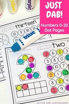 the numbers 0 - 20 dot pages are shown with markers and pens on top of them