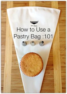 a piece of cake sitting on top of a wooden table next to a white banner that says how to use a pastry bag 101