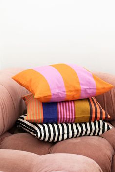 three pillows stacked on top of each other