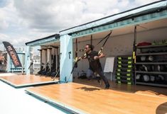 a man is jumping off the back of a boat