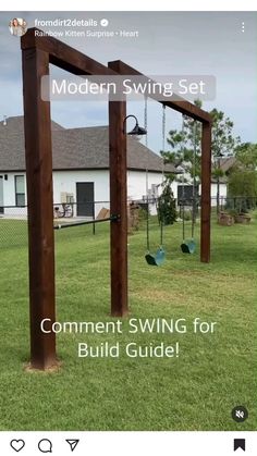 a wooden swing set sitting on top of a lush green field