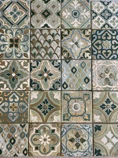 an assortment of tiles with different designs on them