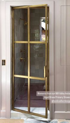 an open glass door in the middle of a room with white walls and tile flooring