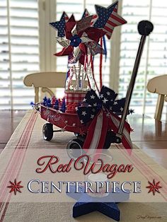 the red, white and blue centerpiece is on display in front of an american flag table runner