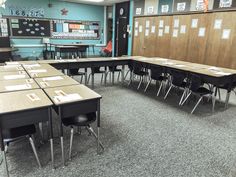 an empty classroom with desks and chairs