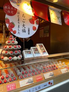 a display case filled with lots of different types of pastries