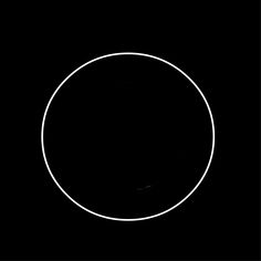 a white circle in the middle of a black background with only one line on it