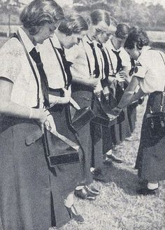 a group of women standing next to each other